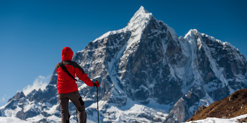 Tourist on mountain looking at Everest summit