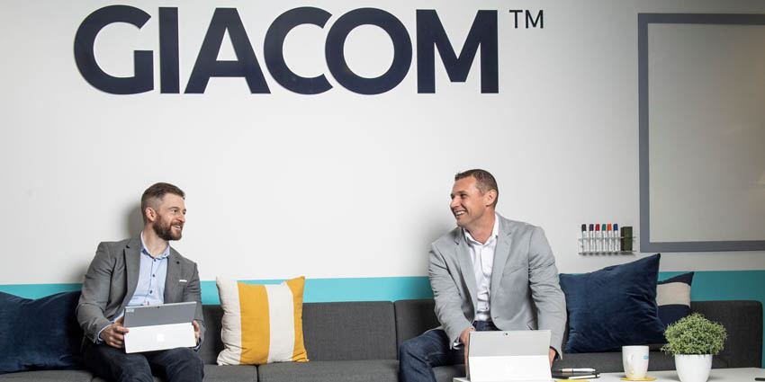 Contrac's Mark Harding sit on sofa with Giacom's Mark Waddell
