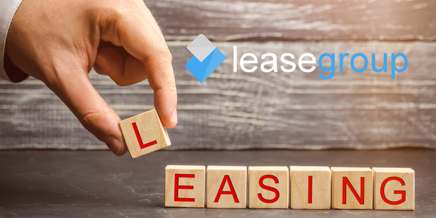 hand with 'L' adding to scrabble tiles to spell 'Leasing' with Lease Group logo