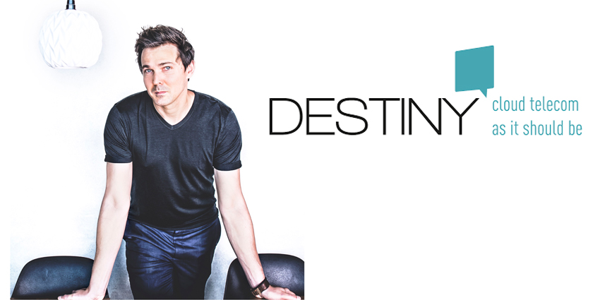 Daan de Wever in casual dress standing over desk with hands placed on desk alongside Destiny logo