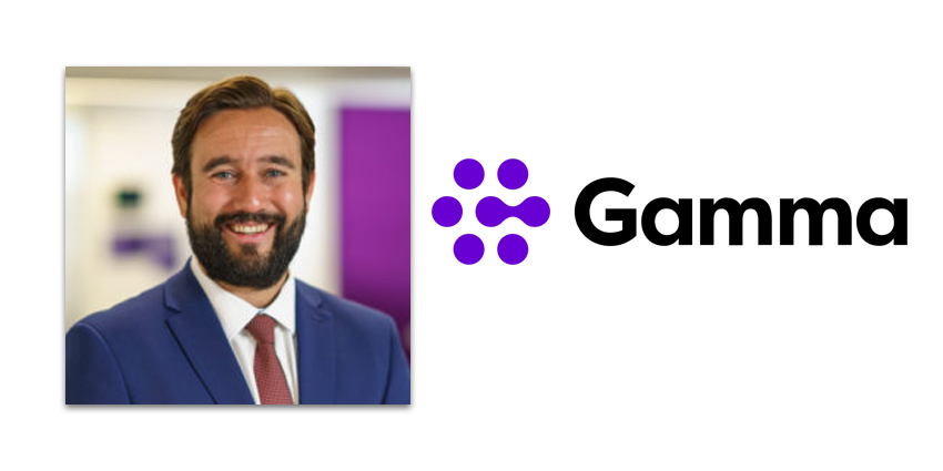 Andrew Smethurs in blue suit against backdrop of Gamma office alongside Gamma logo
