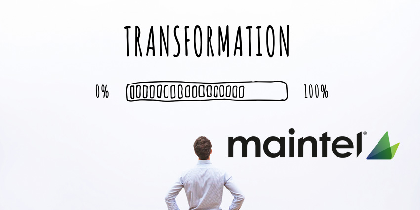 Man standing and looking above him at wall with 'Transformation' written on it and abar drawn in at 70 per cent full