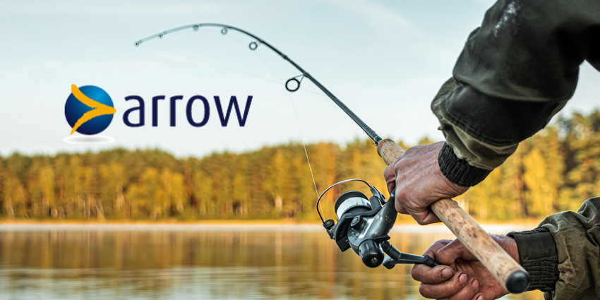 Mans hands holding fishing rod against autumnal backdrop. With Arrow logo