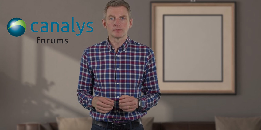 Alastair Edwards standing in furnished room with beige wall and empty frame behind him