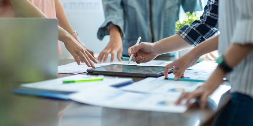 Team collaborating using task management software with shared project boards and task assignments